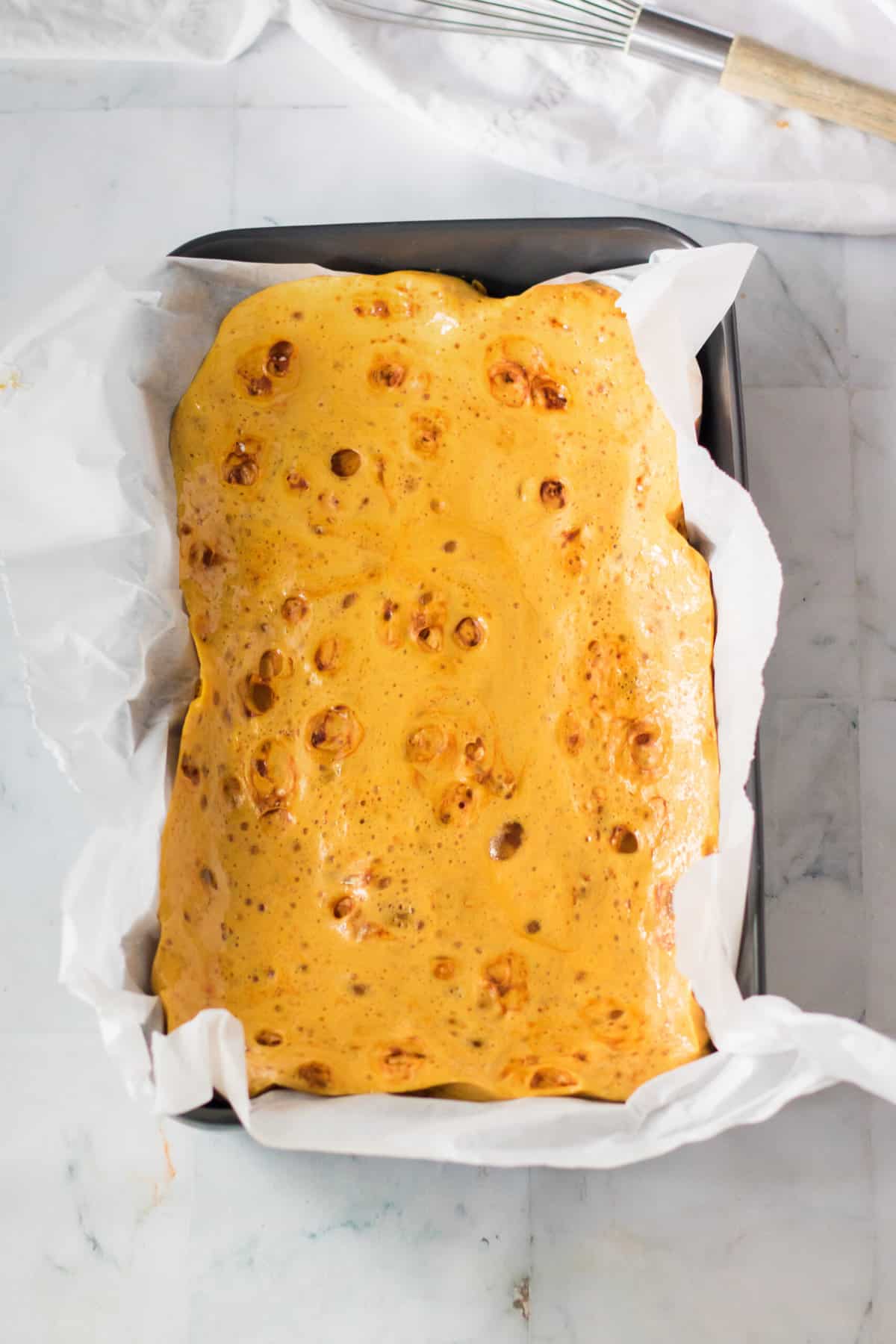 Honeycomb candy in lined pan.