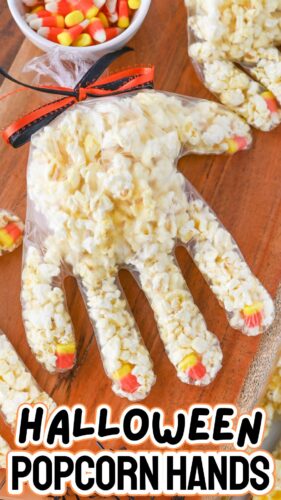 Halloween Popcorn Hands made in plastic disposable gloves with candy corn fingernails.