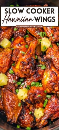 Collage pin showing glazed crockpot Hawaiian chicken wings topped with pineapple and green onions. Bold top text reads &ldquo;Slow Cooker Hawaiian Wings,&rdquo; with the source &ldquo;crayonsandcravings.com&rdquo; below.