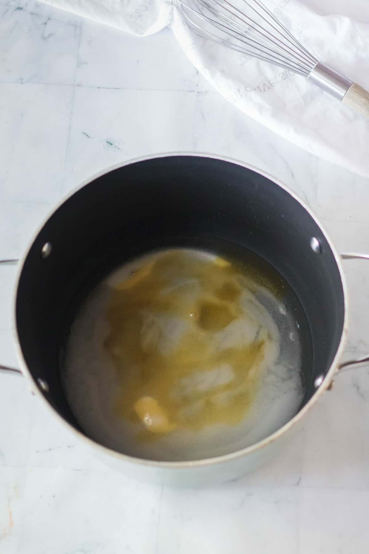 Heavy bottom pot with white, sugar, honey, and corn syrup.